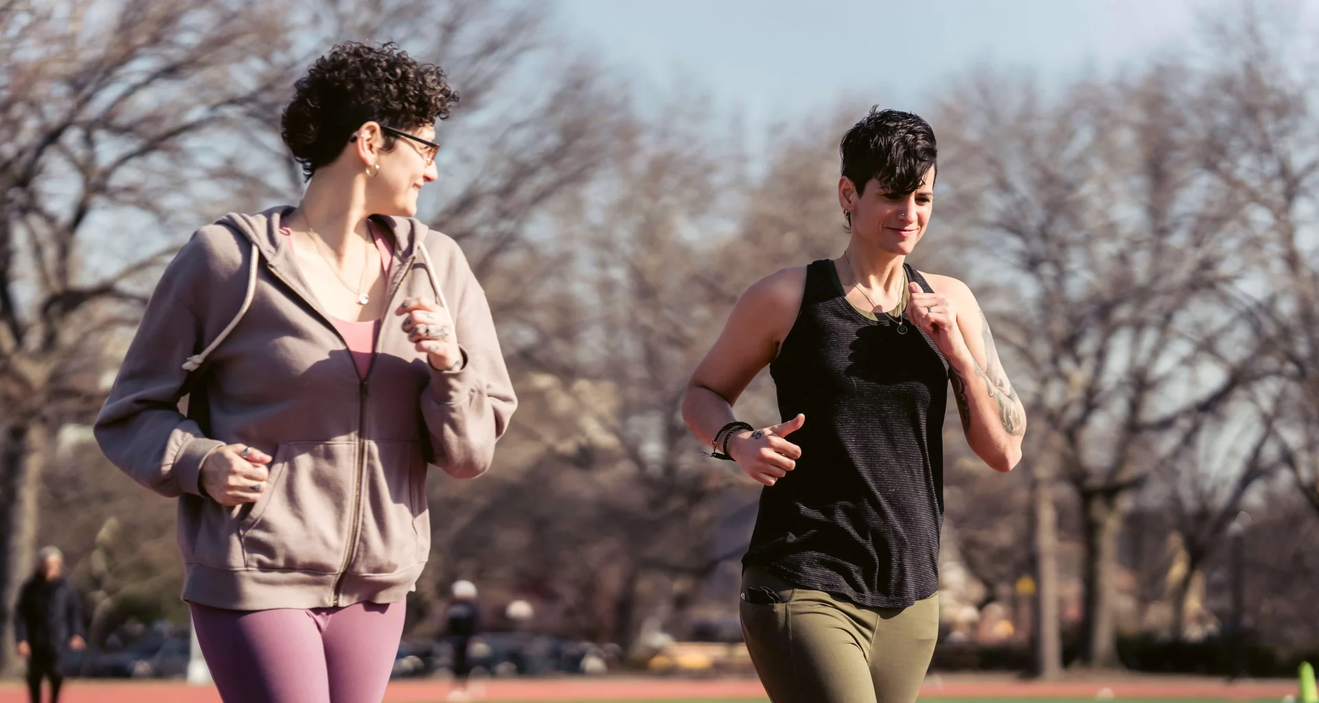Two ladies jogging in a sunny day.