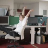 a lazy employee is fiddling around in her office space